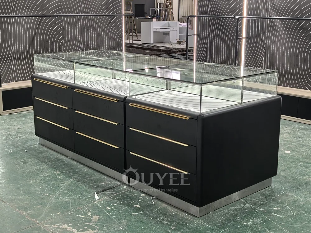 Black Drawer Base Glass Showcase Table with Brass Handles 01