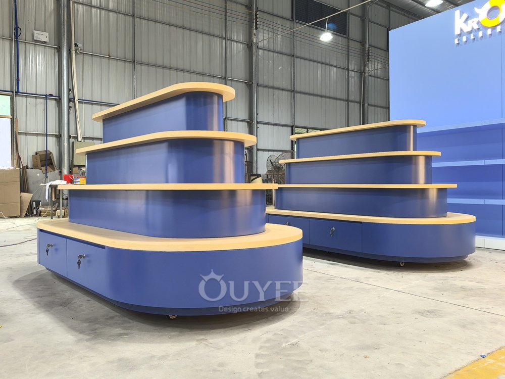 Blue Tiered Island Display Stand with Curved Shelves 02