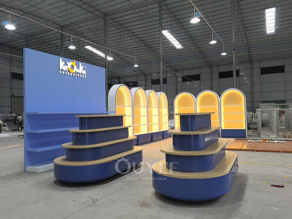 Blue Tiered Island Display Stand with Curved Shelves 03