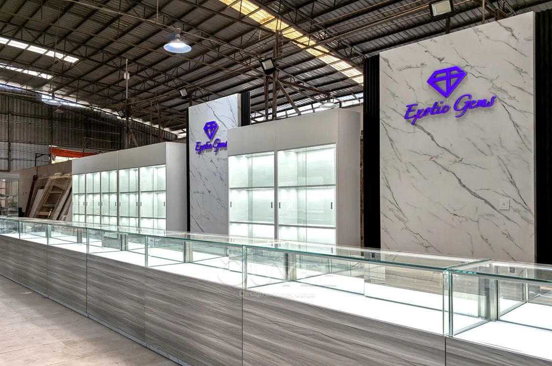 Long Gray Jewelry Showcase Counter with Marble Branding Wall 01