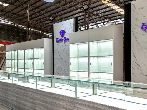 Long Gray Jewelry Showcase Counter with Marble Branding Wall 01