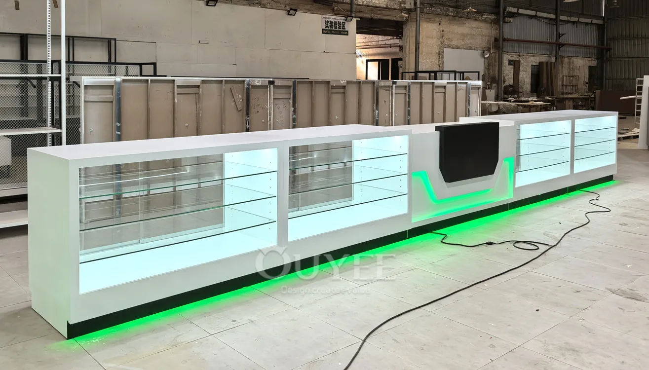 Long White Glass Showcase Counter with Green LED Kicklight 01