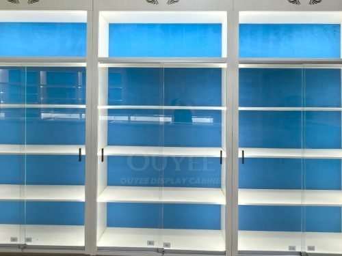 White Backlit Display Cabinet Wall with Blue Panels 01