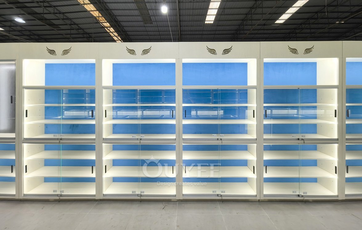 White Backlit Display Cabinet Wall with Blue Panels 03