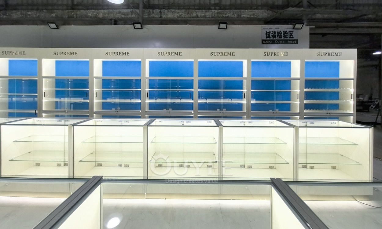 White Backlit Display Cabinet Wall with Blue Panels 04