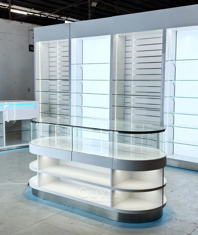 White Oval Glass Showcase Island with Backlit Wall Shelves 01
