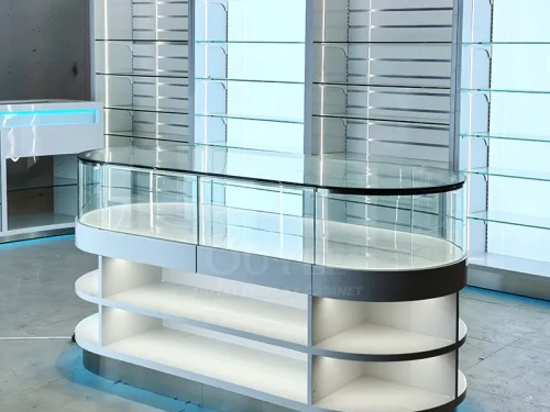 White Oval Glass Showcase Island with Backlit Wall Shelves 01