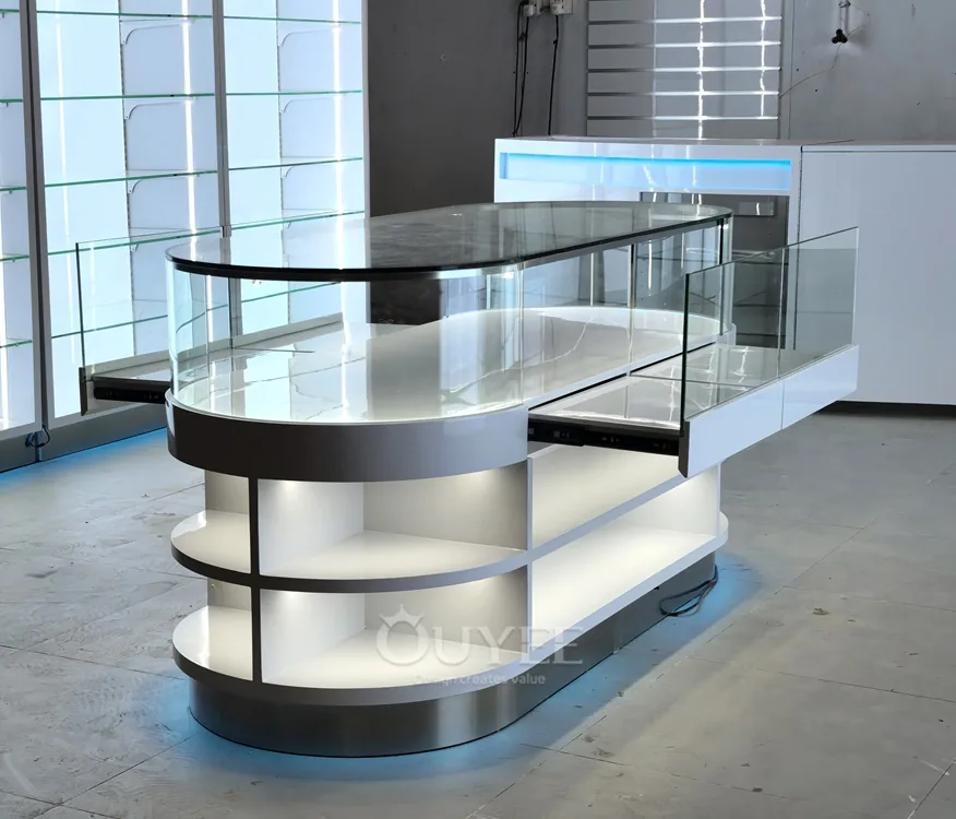 White Oval Glass Showcase Island with Backlit Wall Shelves 03