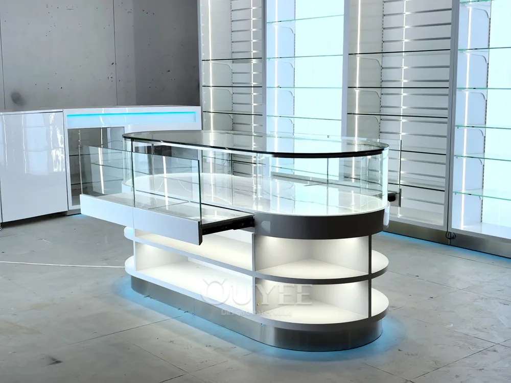 White Oval Glass Showcase Island with Backlit Wall Shelves 04