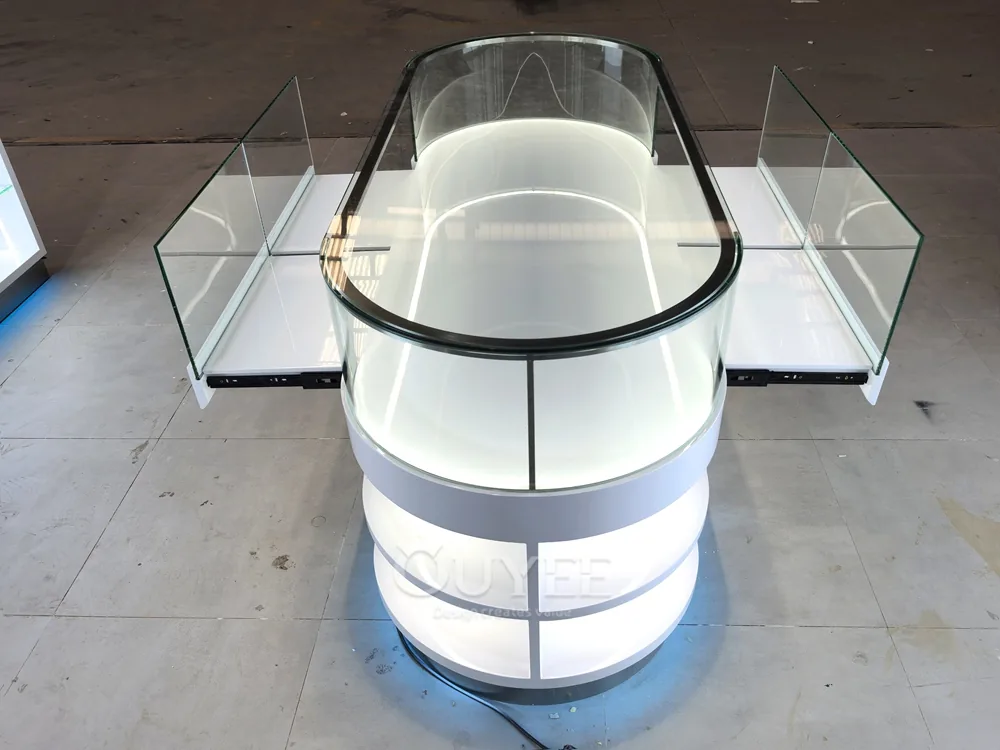 White Oval Glass Showcase Island with Backlit Wall Shelves 05
