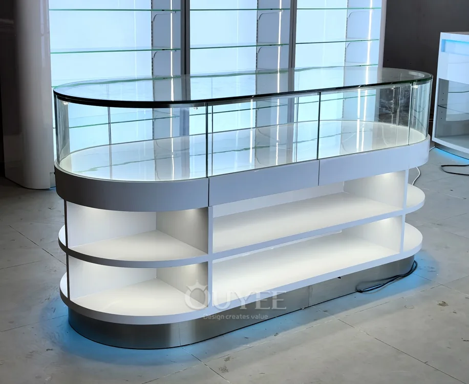 White Oval Glass Showcase Island with Backlit Wall Shelves 06