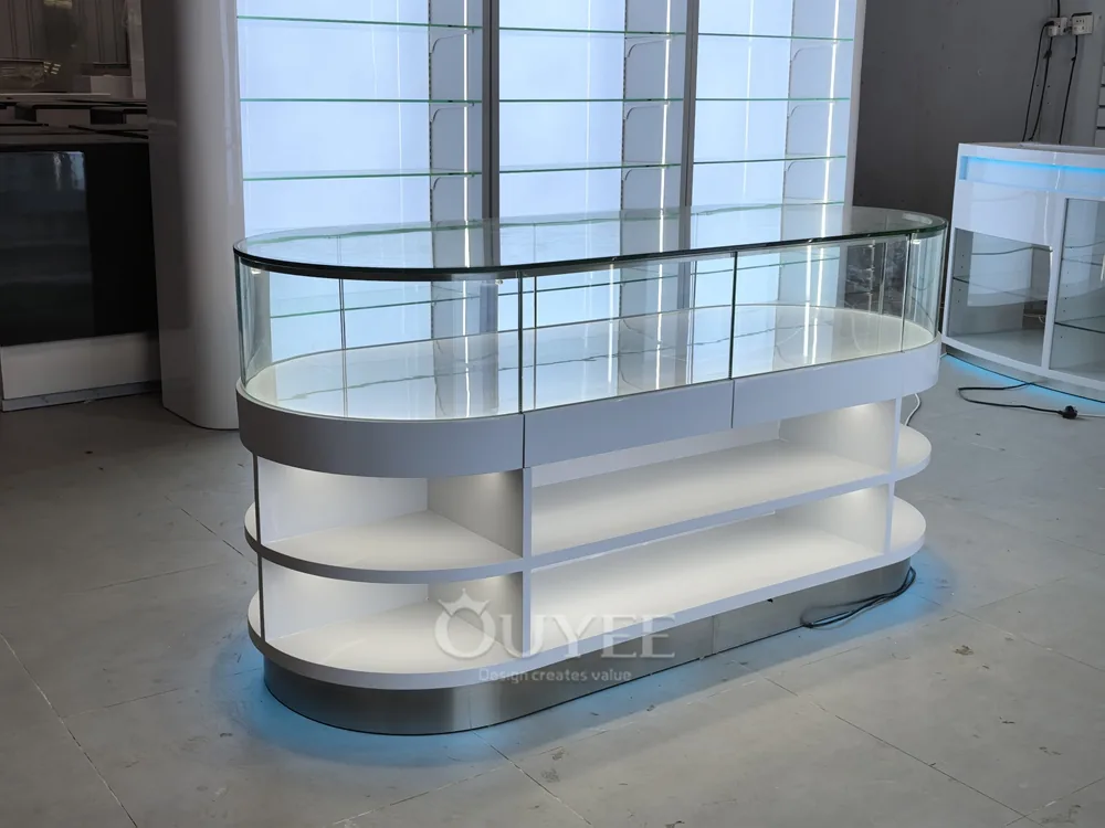 White Oval Glass Showcase Island with Backlit Wall Shelves 07