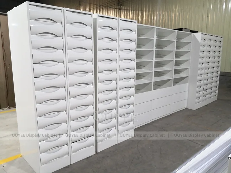White Pharmacy Wall Shelving With Green Accent